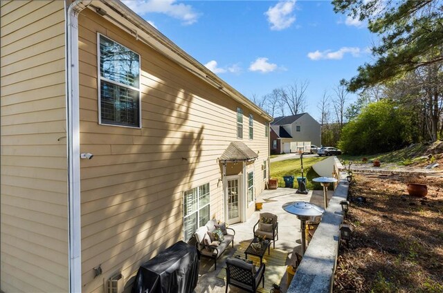 view of property exterior featuring a patio