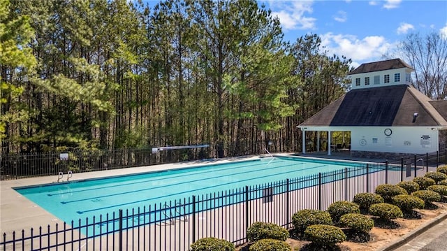 pool featuring a patio area and fence