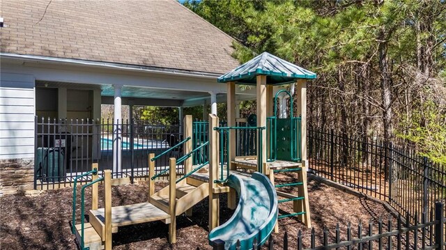 communal playground featuring fence
