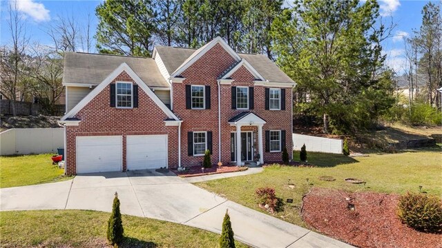 view of front of house featuring brick siding, fence, concrete driveway, a front yard, and a garage