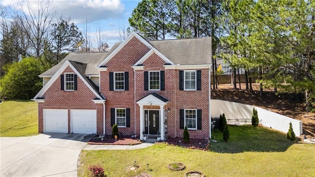 colonial-style house with a front yard, brick siding, and driveway
