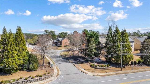 view of road with curbs and sidewalks