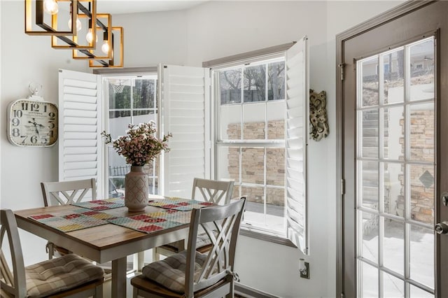 dining area with a notable chandelier