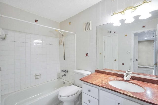 full bath with toilet, shower / bath combination, visible vents, and vanity