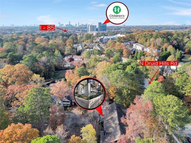 aerial view with a view of trees and a city view