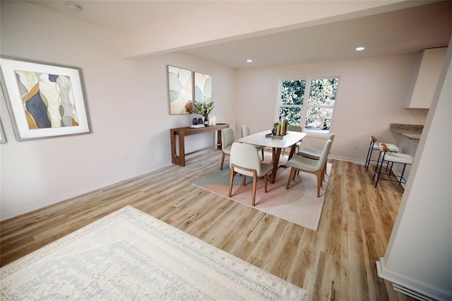 dining area featuring light wood-type flooring