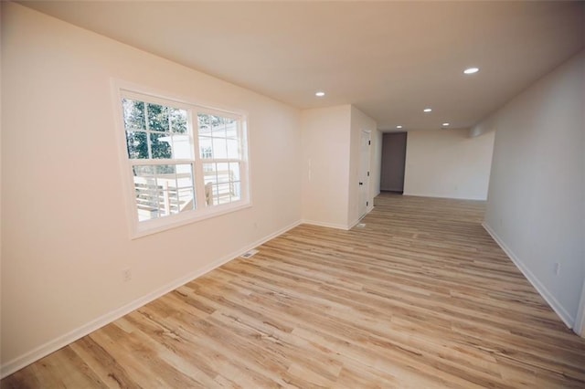 unfurnished room featuring light hardwood / wood-style floors