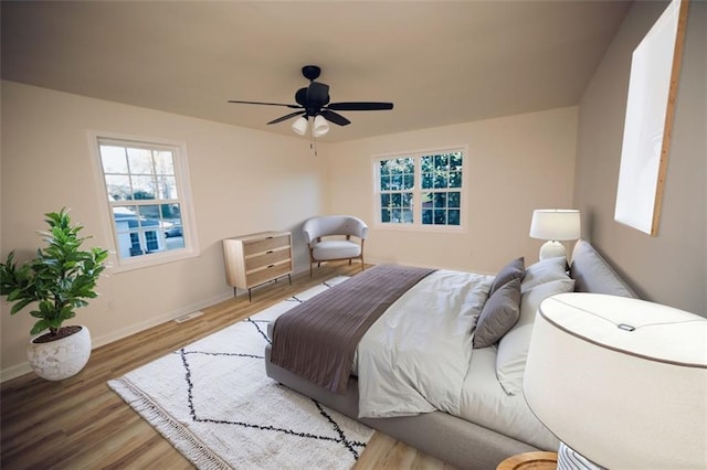 bedroom featuring ceiling fan and hardwood / wood-style floors