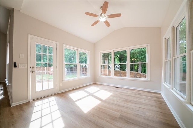 4495 Riders Ridge Trl, Snellville, GA 30039 - unfurnished sunroom with wood finished floors, healthy amount of natural light, lofted ceiling, and baseboards