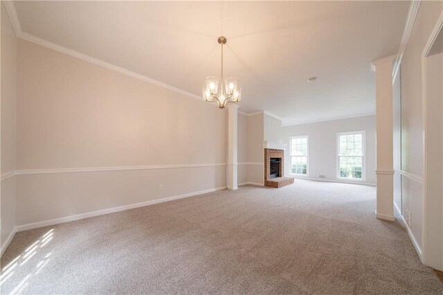 4495 Riders Ridge Trl, Snellville, GA 30039 - unfurnished living room featuring ornamental molding, carpet floors, baseboards, a chandelier, and a fireplace