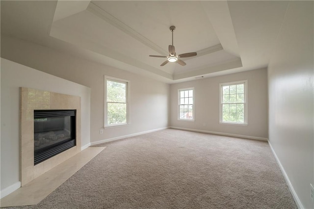4495 Riders Ridge Trl, Snellville, GA 30039 - unfurnished living room with a raised ceiling, a ceiling fan, carpet flooring, a fireplace, and baseboards