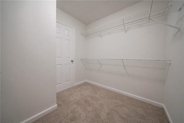 4495 Riders Ridge Trl, Snellville, GA 30039 - walk in closet featuring carpet flooring
