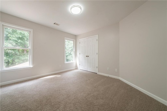 4495 Riders Ridge Trl, Snellville, GA 30039 - unfurnished bedroom with baseboards, carpet, and a closet
