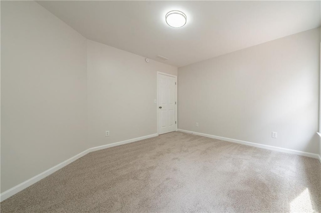 4495 Riders Ridge Trl, Snellville, GA 30039 - spare room with baseboards and light carpet