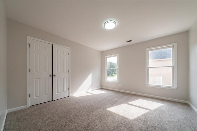 4495 Riders Ridge Trl, Snellville, GA 30039 - unfurnished bedroom featuring carpet flooring, baseboards, and a closet