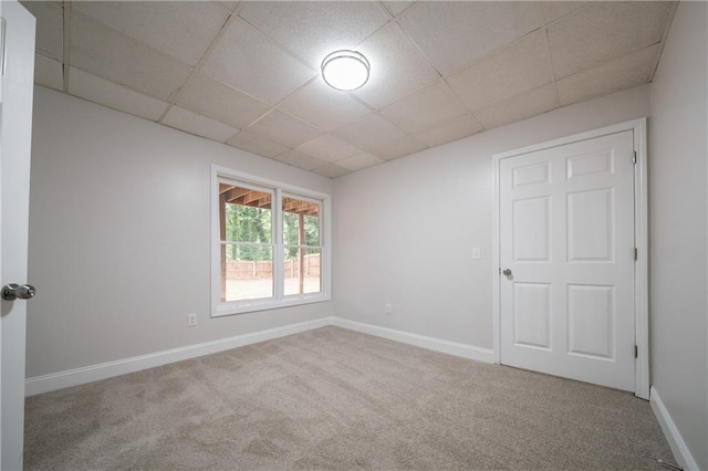 4495 Riders Ridge Trl, Snellville, GA 30039 - carpeted empty room with a paneled ceiling and baseboards
