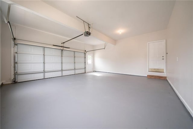 4495 Riders Ridge Trl, Snellville, GA 30039 - garage featuring baseboards and a garage door opener