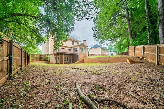4495 Riders Ridge Trl, Snellville, GA 30039 - fenced backyard featuring a wooden deck