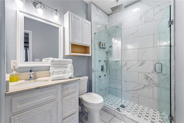 650 Ira St SW, Atlanta, GA 30312 - bathroom featuring toilet, a stall shower, and vanity