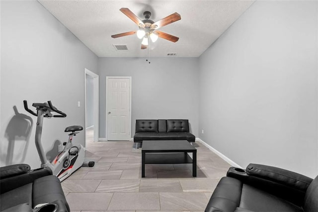 650 Ira St SW, Atlanta, GA 30312 - exercise room with a textured ceiling, ceiling fan, baseboards, and visible vents