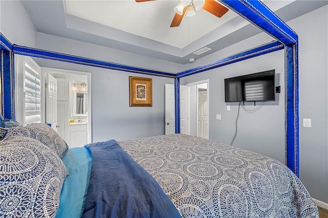 650 Ira St SW, Atlanta, GA 30312 - bedroom featuring a tray ceiling, ceiling fan, visible vents, and connected bathroom