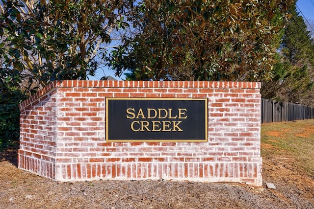 community sign with fence