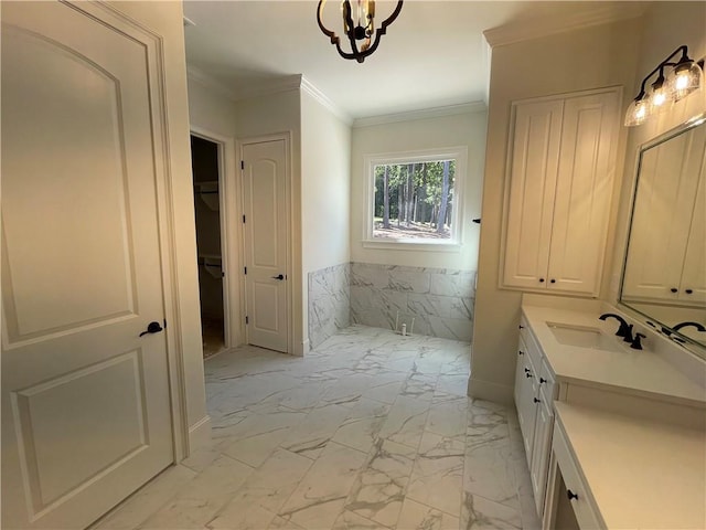 bathroom with a notable chandelier, vanity, tile flooring, and ornamental molding