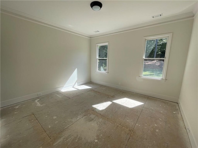 unfurnished room with crown molding