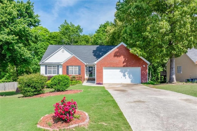 single story home with an attached garage, a front yard, driveway, and brick siding