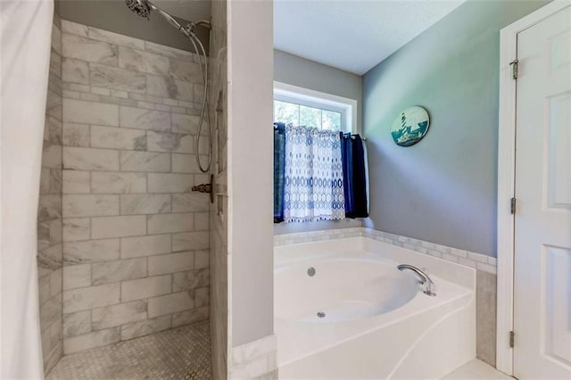 full bathroom with tiled shower and a garden tub