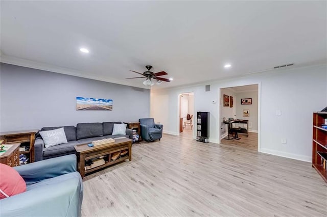 living room featuring recessed lighting, crown molding, a ceiling fan, and light wood finished floors