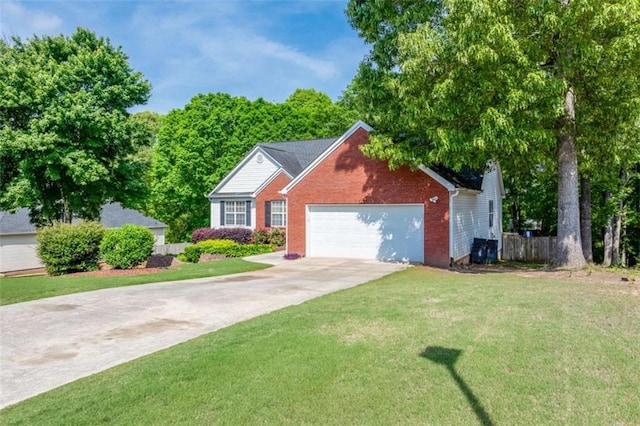 view of front of home featuring fence, an attached garage, brick siding, a front yard, and concrete driveway