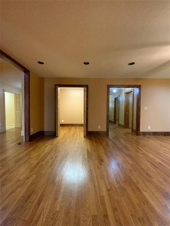 spare room with wood-type flooring