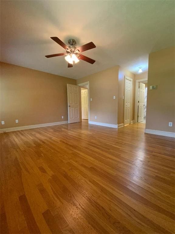 spare room with light hardwood / wood-style flooring and ceiling fan