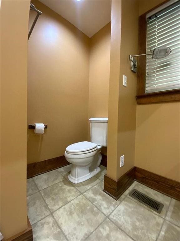 bathroom featuring tile patterned floors and toilet