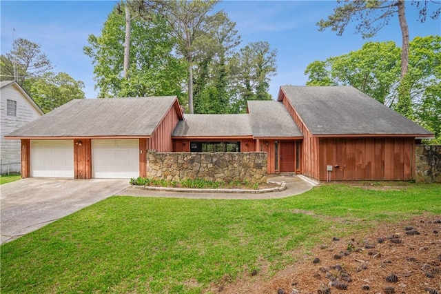 view of front of house with stone siding, a front yard, board and batten siding, an attached garage, and driveway