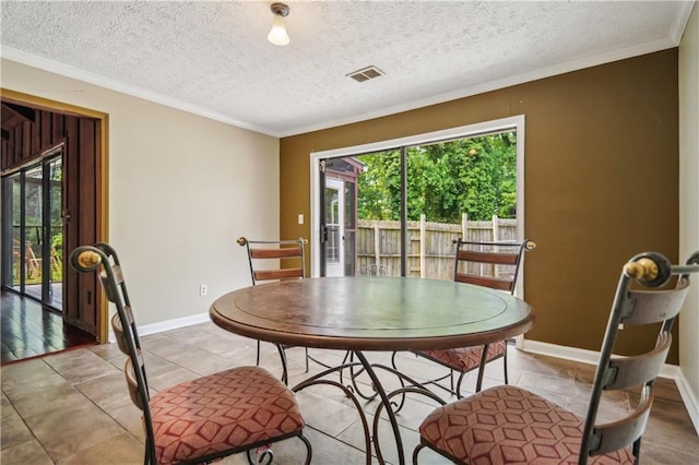 dining area with baseboards, plenty of natural light, and ornamental molding