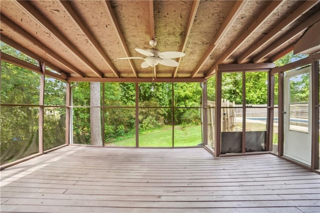 unfurnished sunroom with ceiling fan