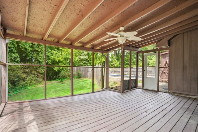 unfurnished sunroom featuring ceiling fan