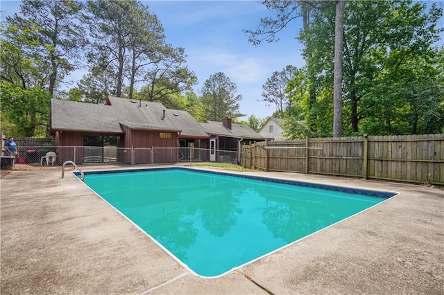 view of pool featuring a fenced in pool, a fenced backyard, and a patio