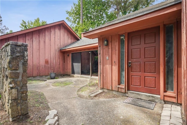 doorway to property featuring board and batten siding