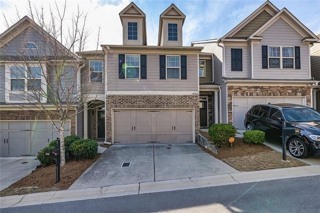 5008 Whiteoak Pointe SE Unit 15, Smyrna, GA 30080 - view of property featuring a garage and concrete driveway