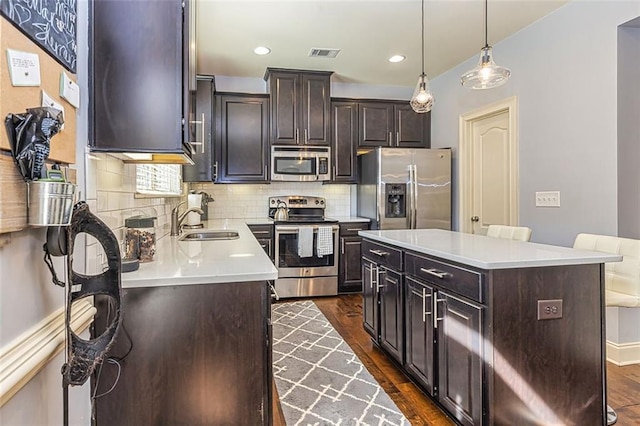 5008 Whiteoak Pointe SE Unit 15, Smyrna, GA 30080 - kitchen with appliances with stainless steel finishes, a sink, dark wood finished floors, backsplash, and recessed lighting