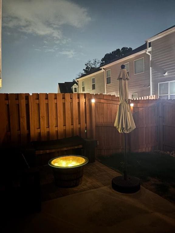 5008 Whiteoak Pointe SE Unit 15, Smyrna, GA 30080 - fenced backyard featuring an outdoor fire pit and a patio area
