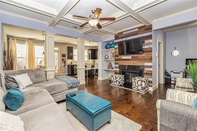 5008 Whiteoak Pointe SE Unit 15, Smyrna, GA 30080 - living room featuring ornate columns, wood finished floors, a large fireplace, a ceiling fan, and crown molding