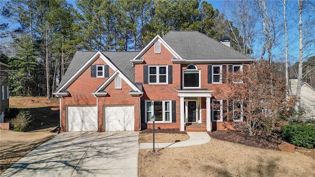 view of front of property with a garage