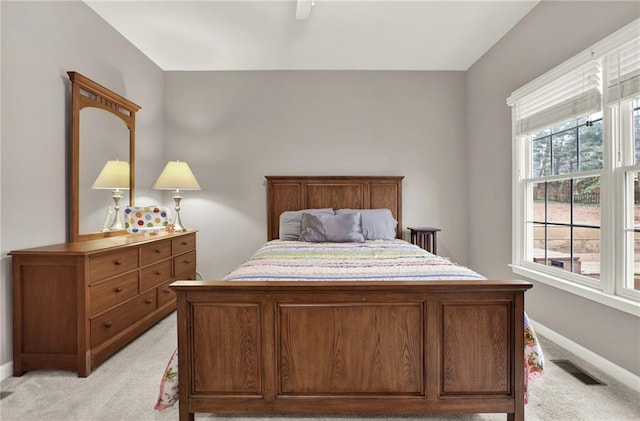 bedroom featuring light colored carpet