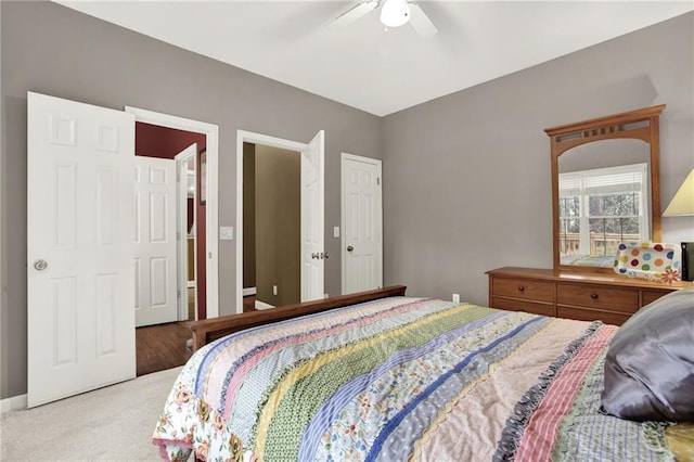 carpeted bedroom featuring ceiling fan