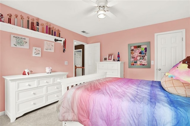 carpeted bedroom with ceiling fan