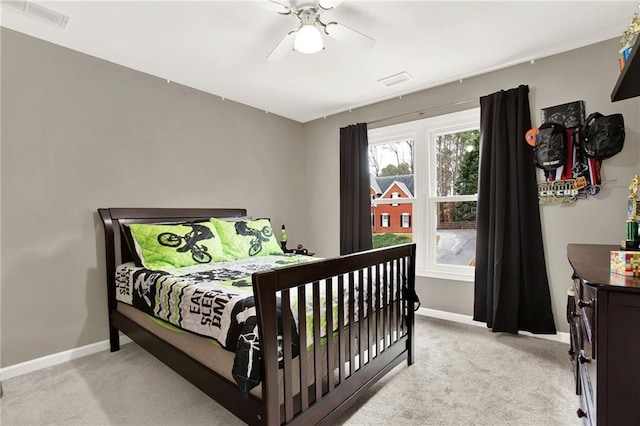 carpeted bedroom with ceiling fan